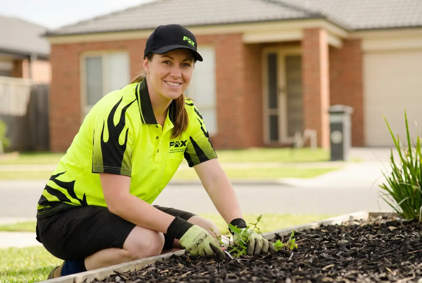 A Fox Mowing and Gardening franchise owner at work
